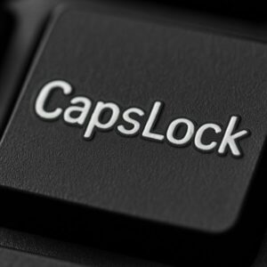 キーボード上のCaps Lockキーをクローズアップで撮影した画像。黒いキーに白い「CapsLock」の文字がくっきりと浮かび上がり、質感のあるマットな表面が印象的。