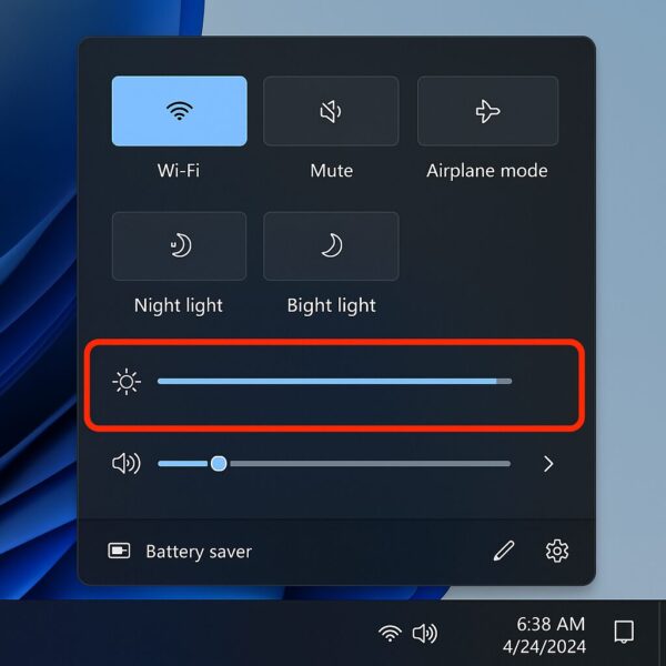 Windows 11 quick settings panel with brightness slider highlighted